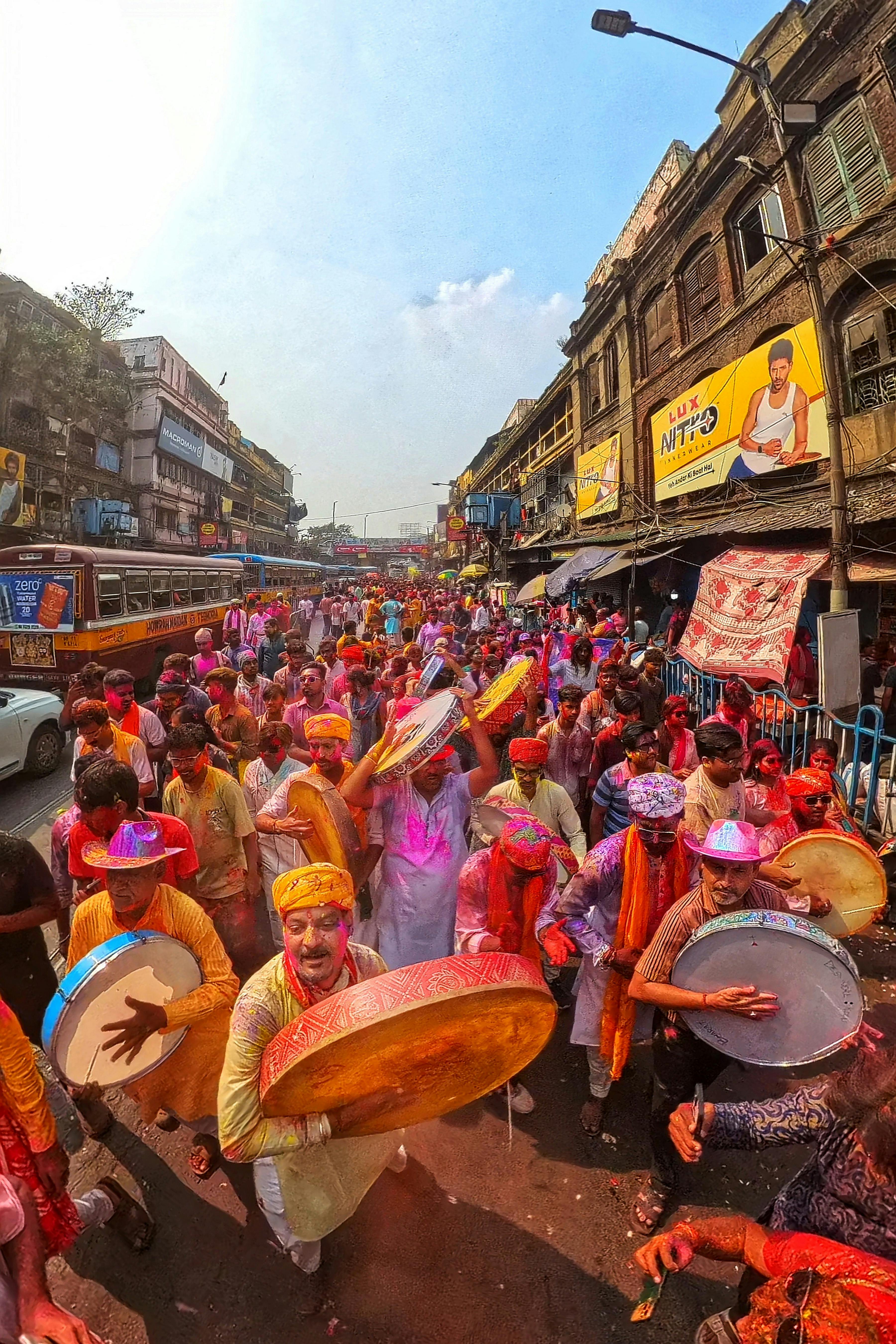 Colorful Holi festival celebration with joyful people in Kolkata, India, embracing tradition with vibrant colors and cultural festivities.