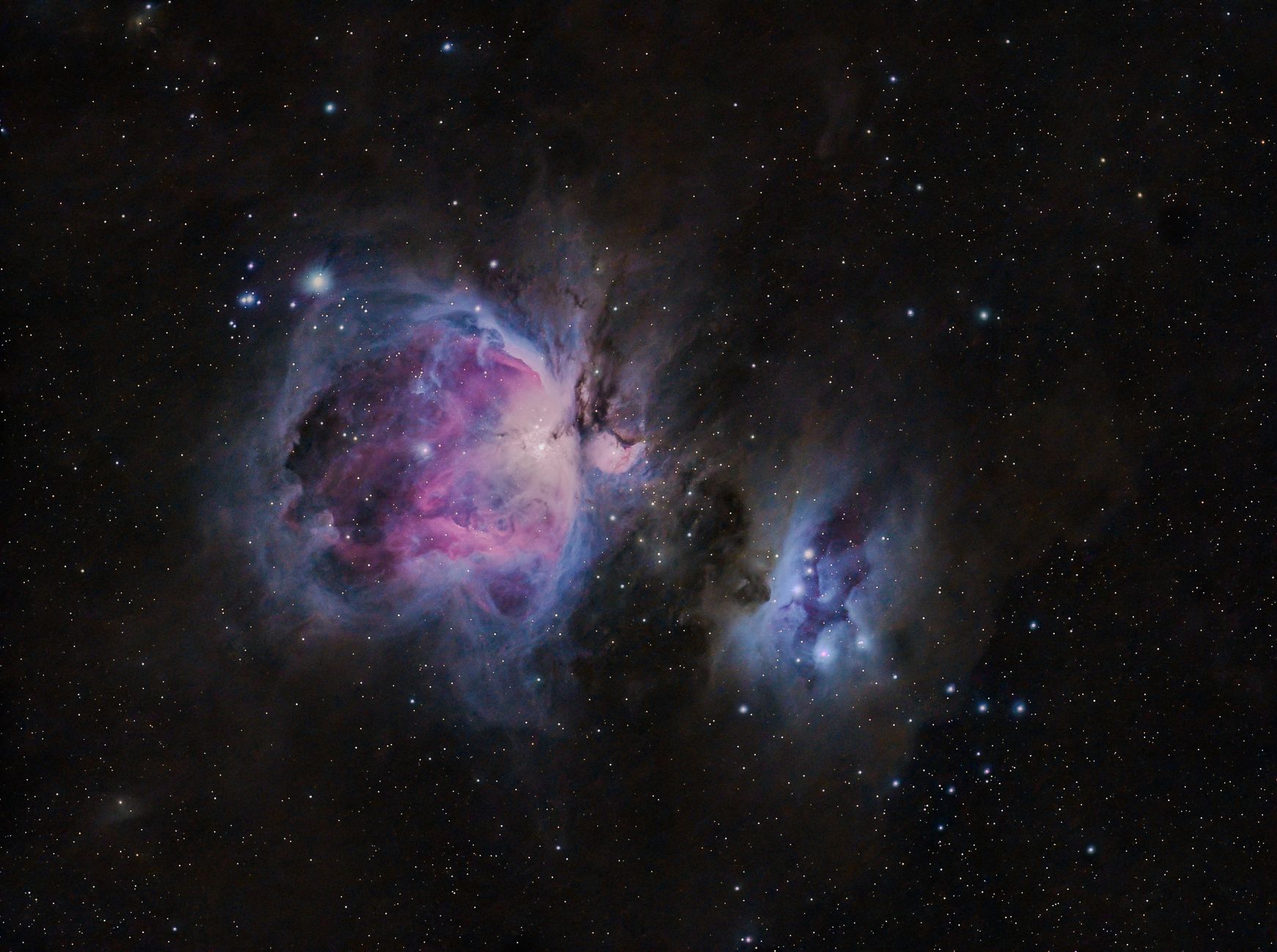 Captivating image of the Orion Nebula showcasing vivid celestial colors in deep space.