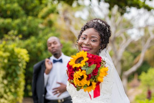 Photo Of Woman Holding Bouquet Of Flowers