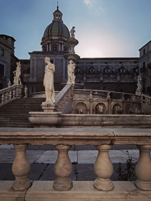 Free Stunning view of the Piazza Pretoria Fountain with sculptures at sunset in Palermo, Italy. Stock Photo