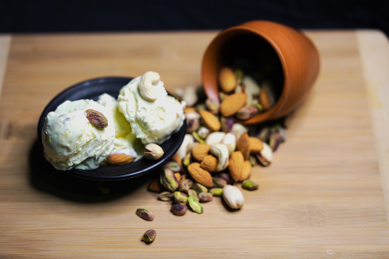 American Dry Fruit ice cream topped with almonds, cashews and pistachios
