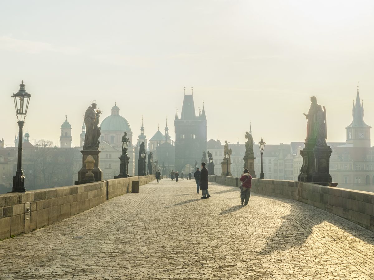 Charles Bridge in the morning mist, Prague's quintessential romantic walk