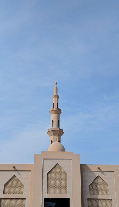 Free A beautiful minaret rises against a clear blue sky in Kasur, Punjab, Pakistan, showcasing Islamic architecture. Stock Photo
