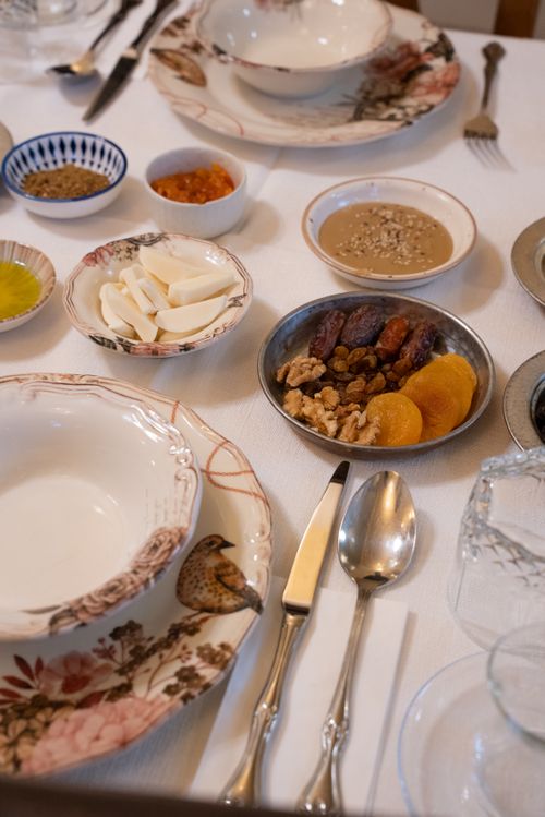 Free A beautifully arranged Turkish breakfast with nuts, dried fruits, and decorative plates in Gaziantep. Stock Photo