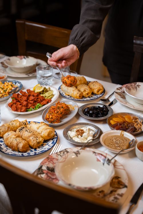 Free Traditional Turkish breakfast with various dishes served on a vibrant table in Gaziantep. Stock Photo