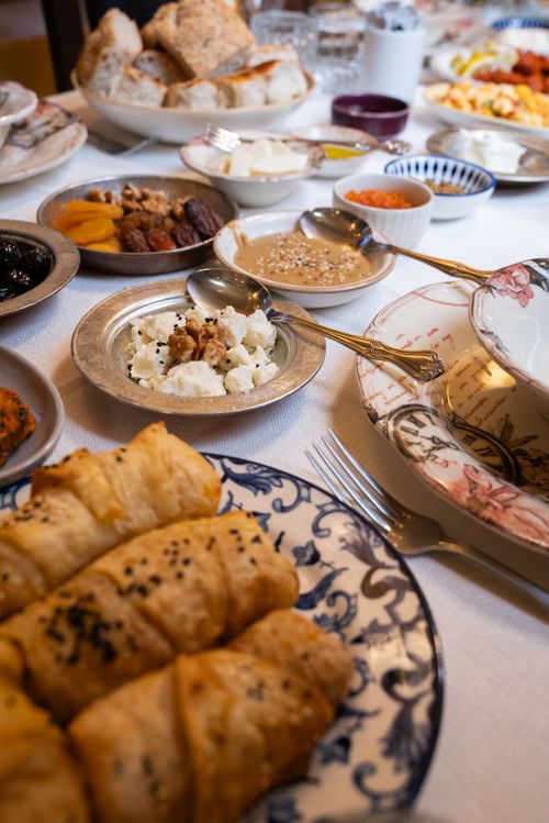 Free A traditional Turkish breakfast with various breads, cheeses, and olives in Gaziantep, Turkey. Stock Photo