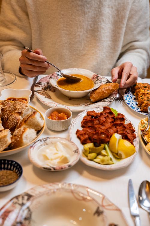 Free Traditional Turkish breakfast featuring lentil soup, bread, and various dishes, ideal for cultural and food themes. Stock Photo