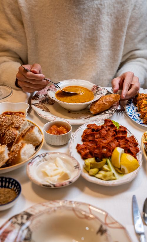Free Delicious Turkish meal with soup, bread, and appetizers in Gaziantep. Stock Photo