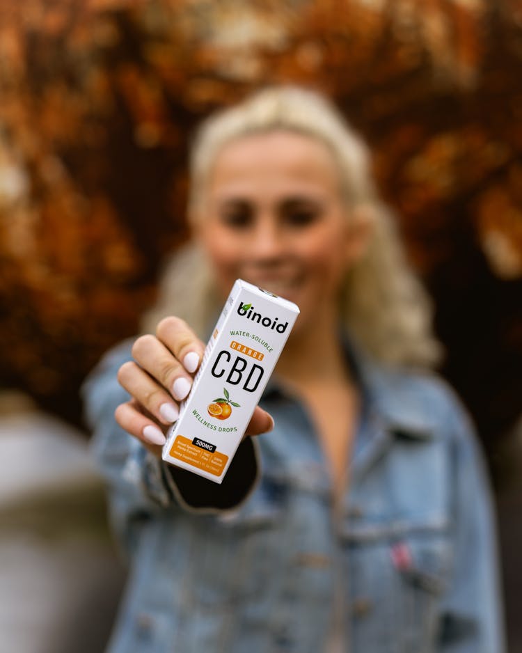 Woman Holding A Medicine Box Of CBD