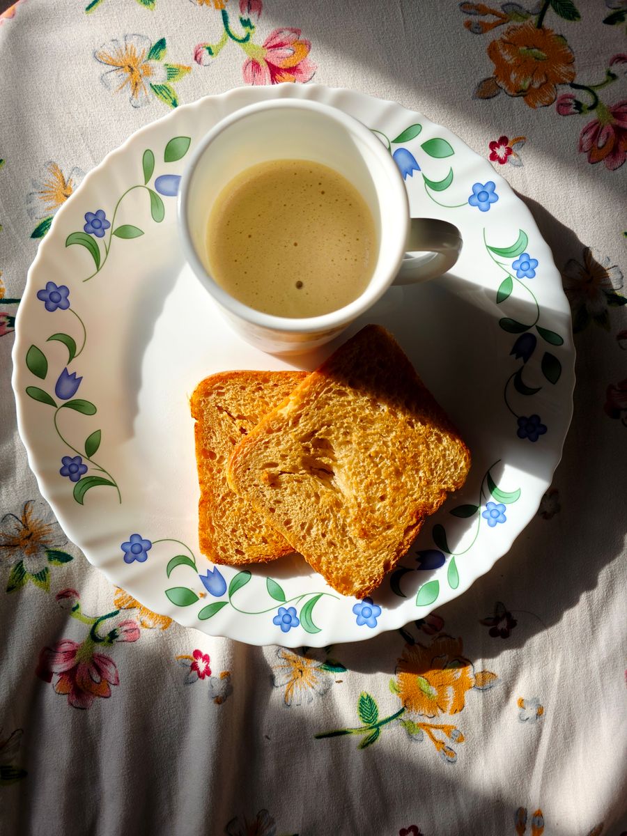 Warm breakfast plate with coffee
