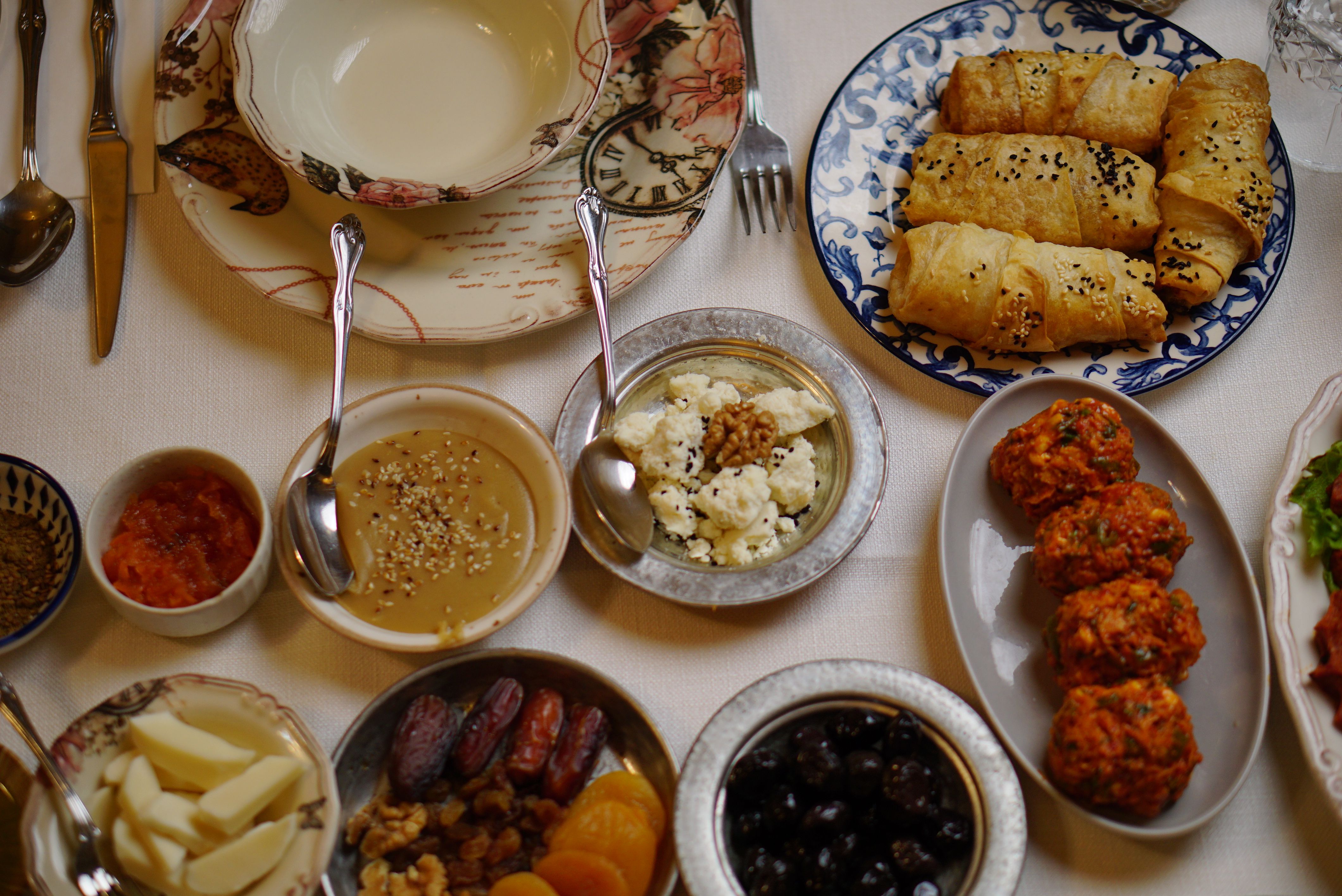 Delight in a Turkish breakfast with simit, cheeses, olives, and more, showcasing rich culinary culture.