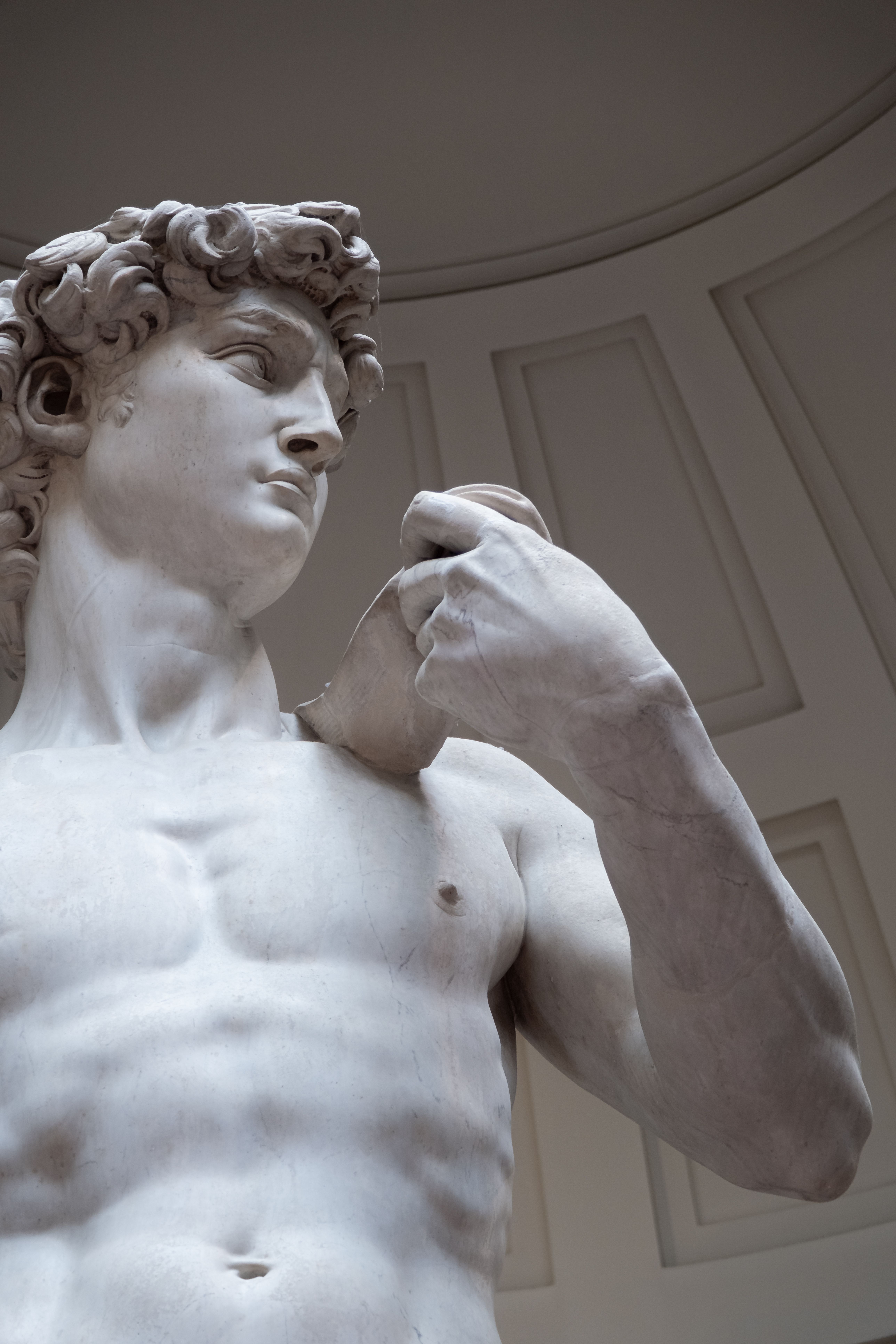 Close-up of Michelangelo's David statue at Galleria dell'Accademia, Florence.