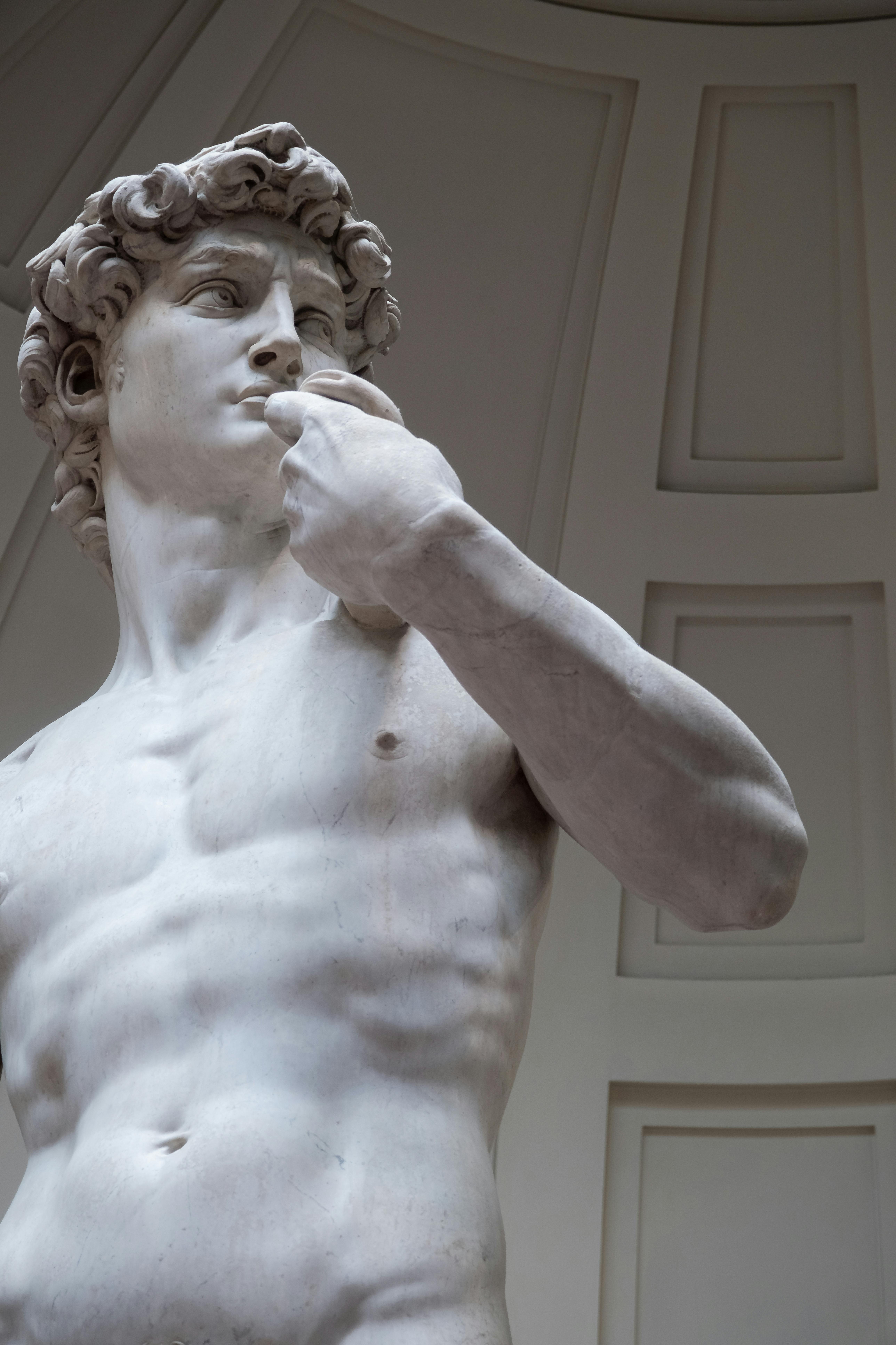 Detailed view of Michelangelo's David, showcasing intricate Renaissance artistry in Florence, Italy.