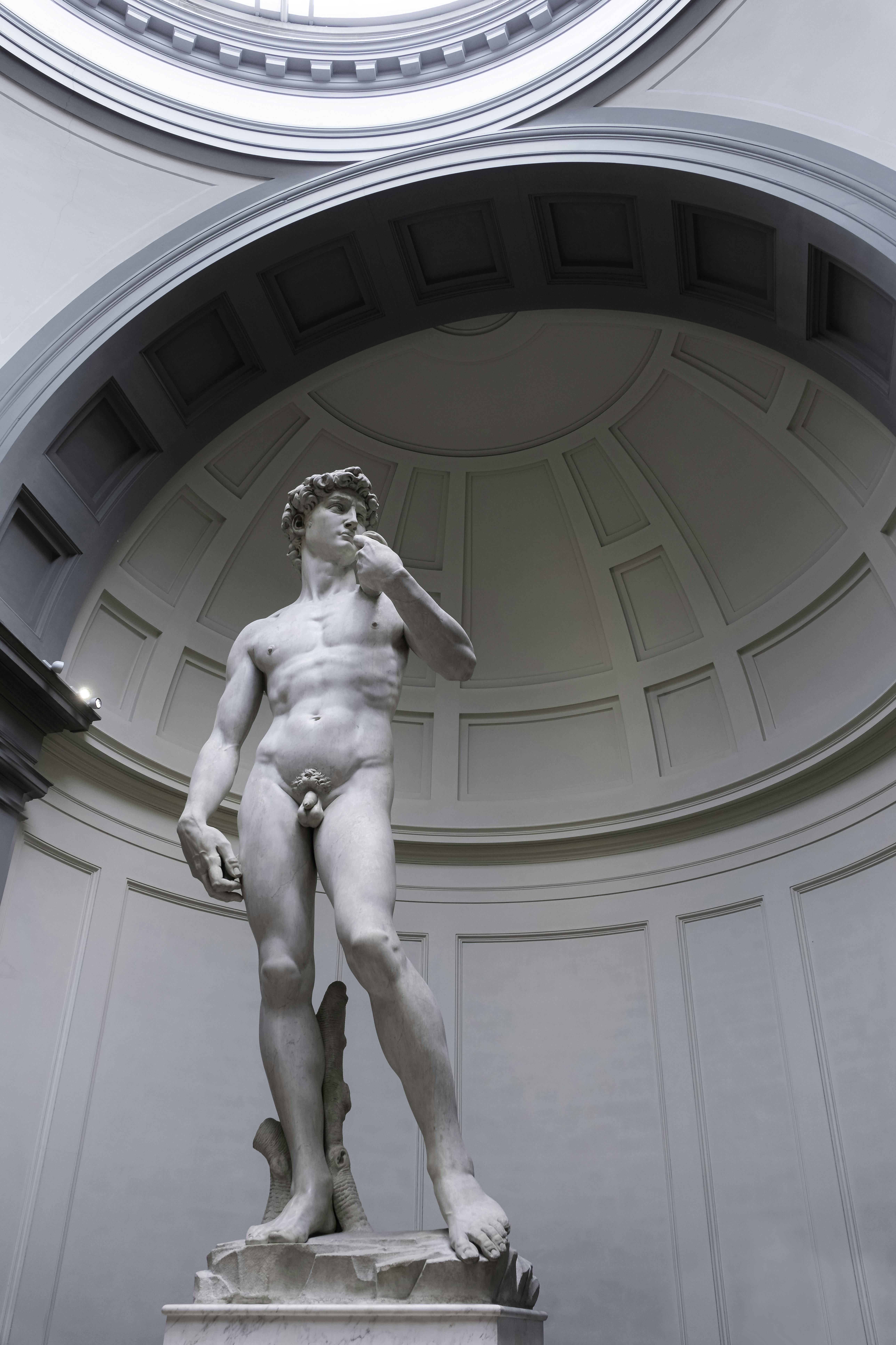 Statue of David by Michelangelo at the Accademia Gallery in Florence, Italy, displaying Renaissance art mastery.