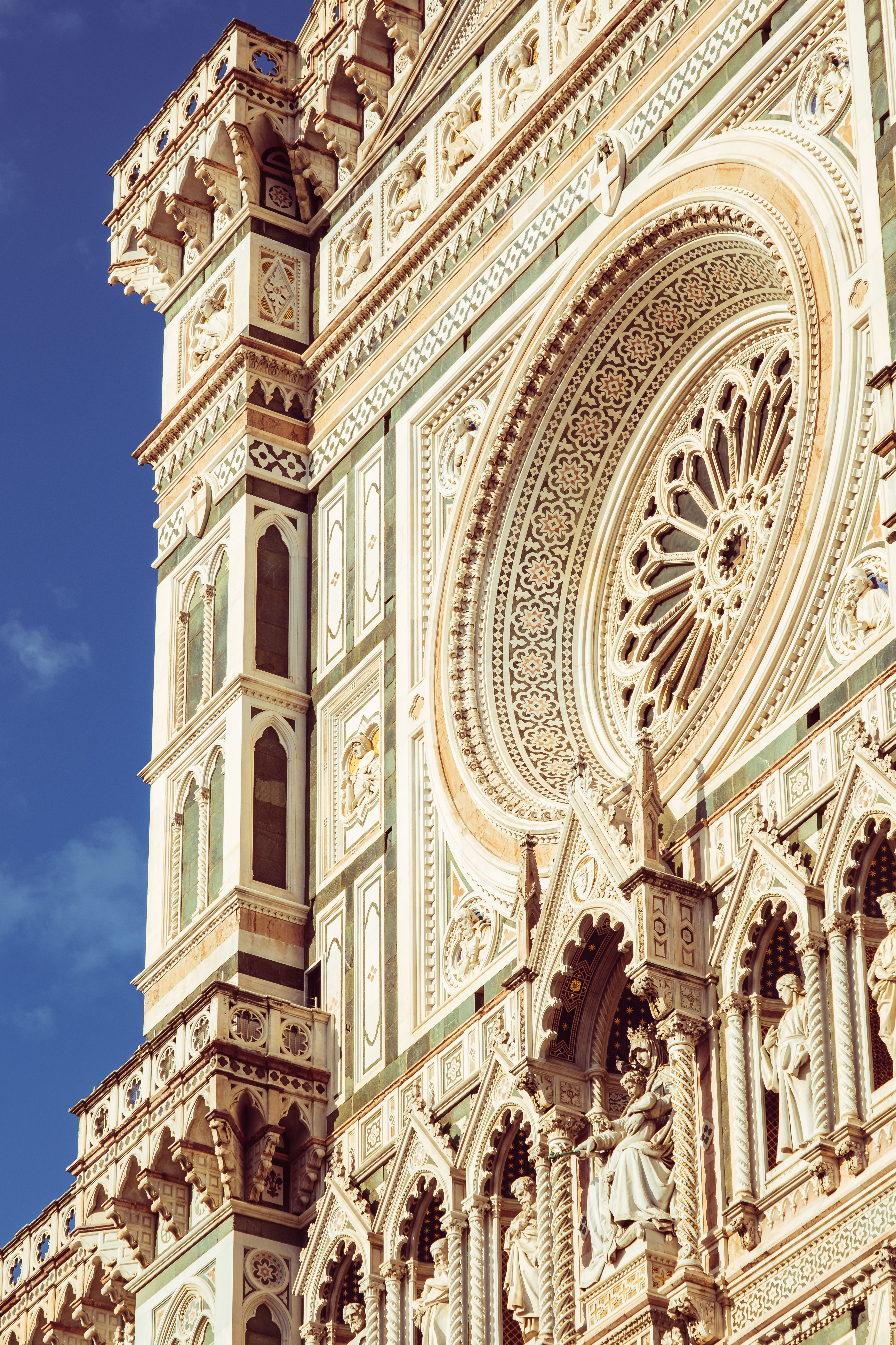 Intricate facade of Santa Maria del Fiore Cathedral in Florence highlighting architectural beauty.