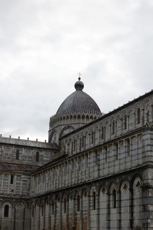 Free Intricate architectural detailing of the Pisa Cathedral dome in Italy. Stock Photo