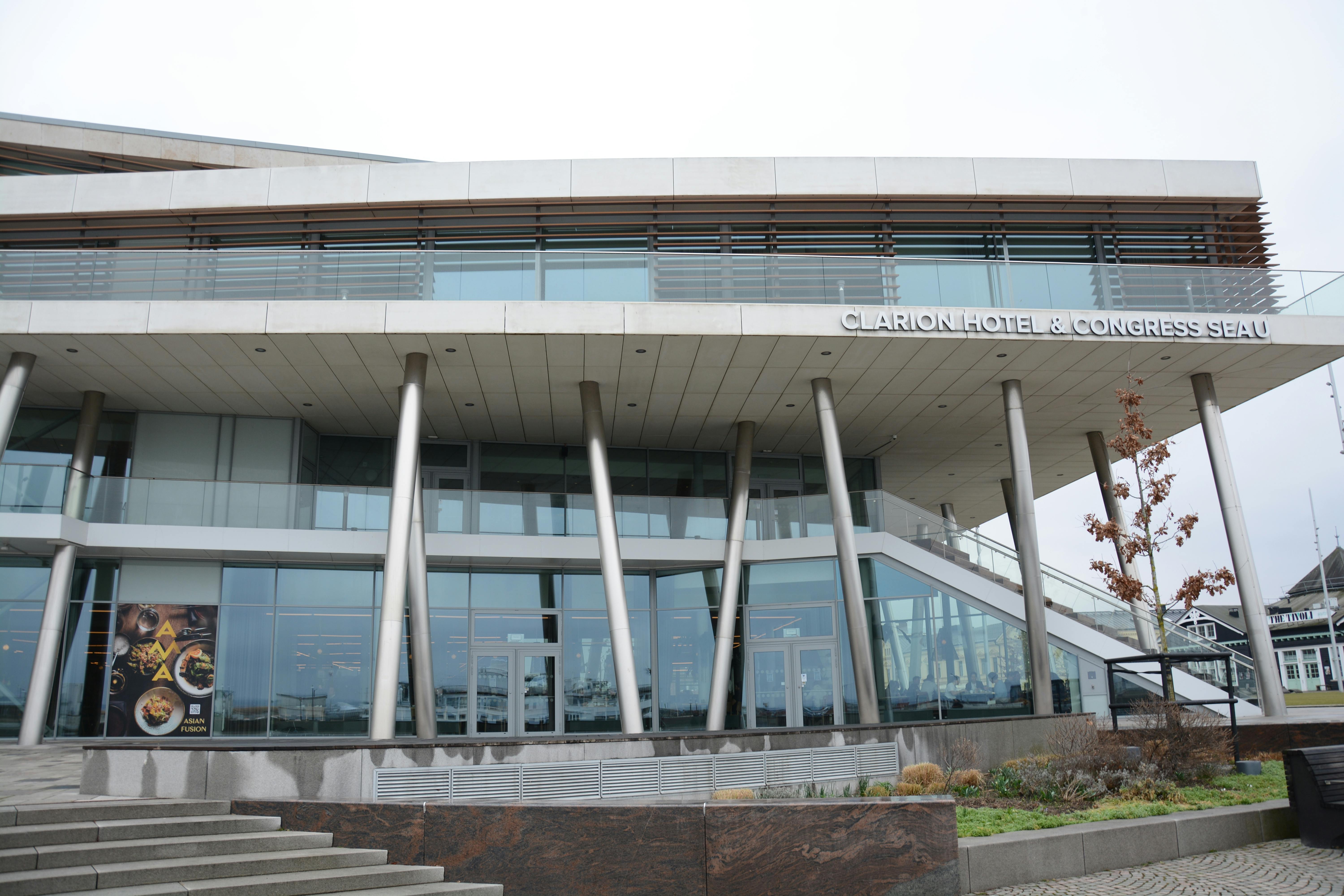 Free Front view of Clarion Hotel showcasing modern design and glass facade. Stock Photo
