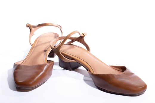 Tan leather slingback heels, photo by Valentin Ivantsov on Pexels