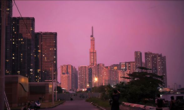 Panoramic twilight view of Landmark 81 surrounded by the Ho Chi Minh City skyline, Vietnam.