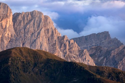 Free Stunning view of the Dolomite Mountains at sunset with rugged peaks and dramatic sky. Stock Photo