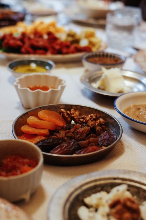 Free Close-up of assorted dried fruits and nuts set on a table for a festive family dinner. Stock Photo