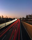 Dynamic Highway Light Trails at Dusk