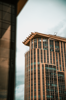 Captivating view of a modern skyscraper in Bangkok, showcasing urban architectural design.