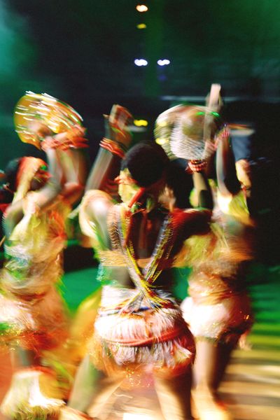 Blurred colourful folk dancers on stage, photo by Wale Adebisi on Pexels