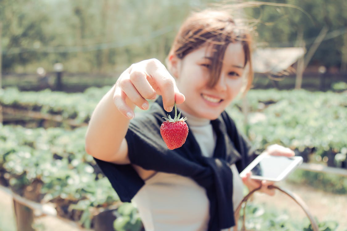 Woman Holding Strawberry