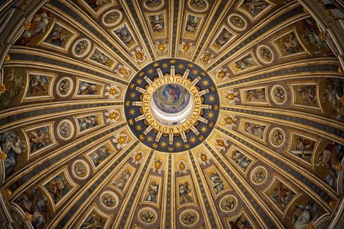 Free A detailed view of the ornate dome inside St. Peter's Basilica, showcasing Renaissance art and architecture. Stock Photo