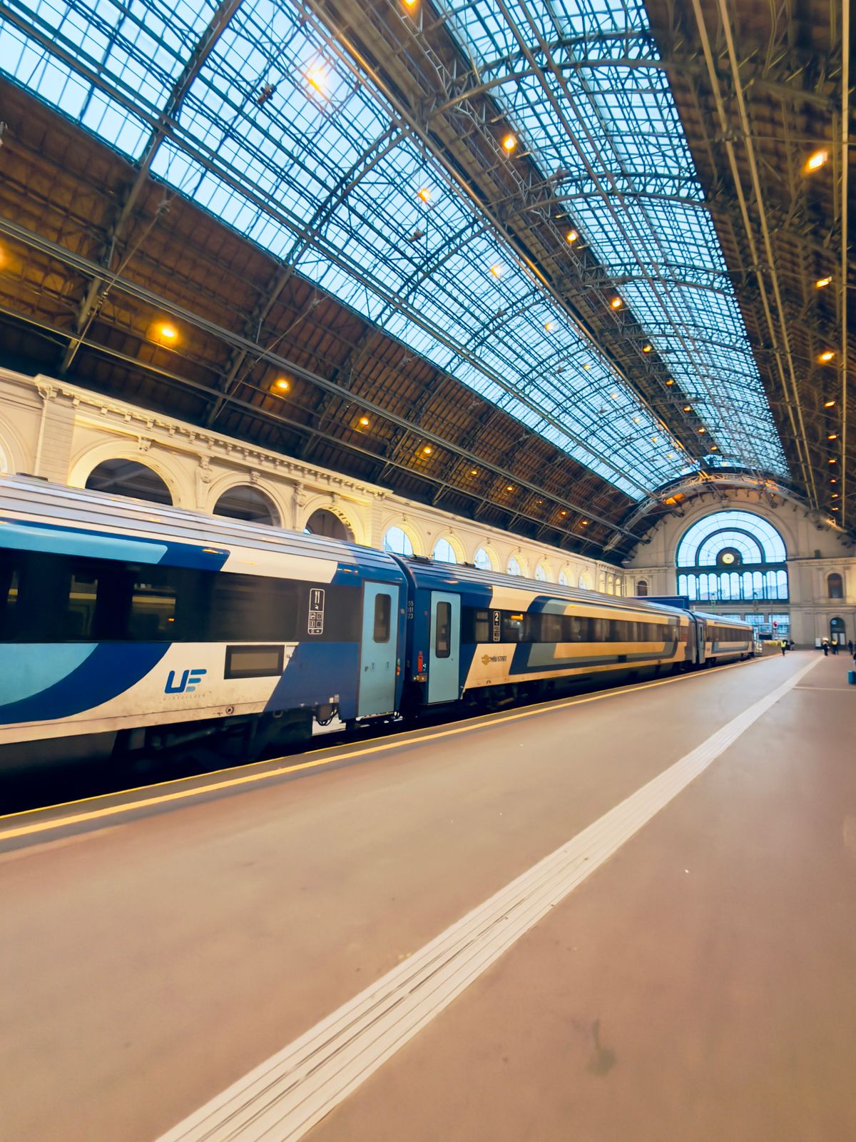 A Silver and Blue Train in a Train Station · Free Stock Photo