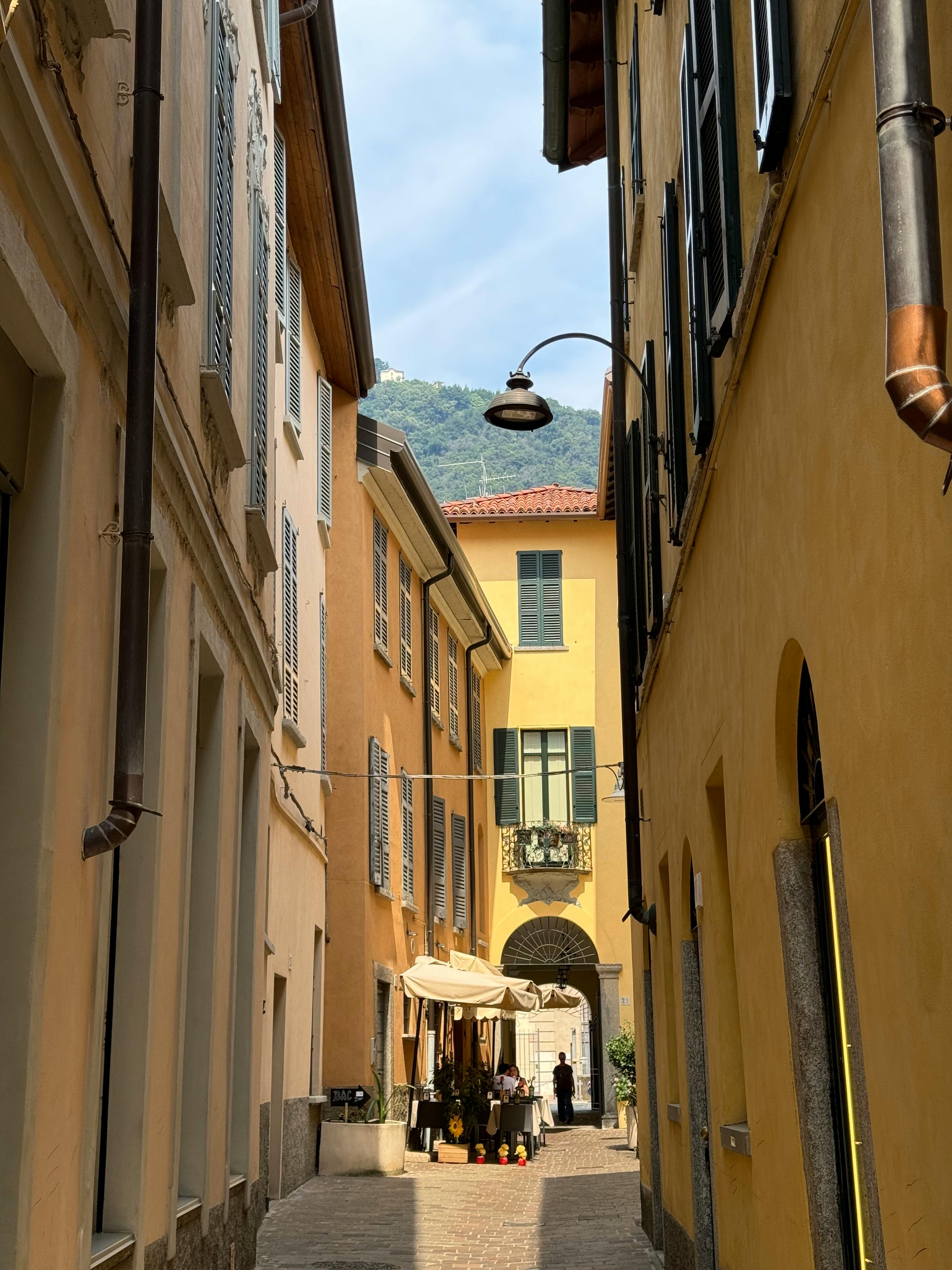 Historic streets of Como city centre in Italy with traditional Italian architecture, charming storefronts, and a walkable Roman-era street grid — a vibrant lakeside city in Lombardy