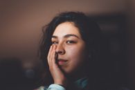 Photo of Woman Touching Her Face