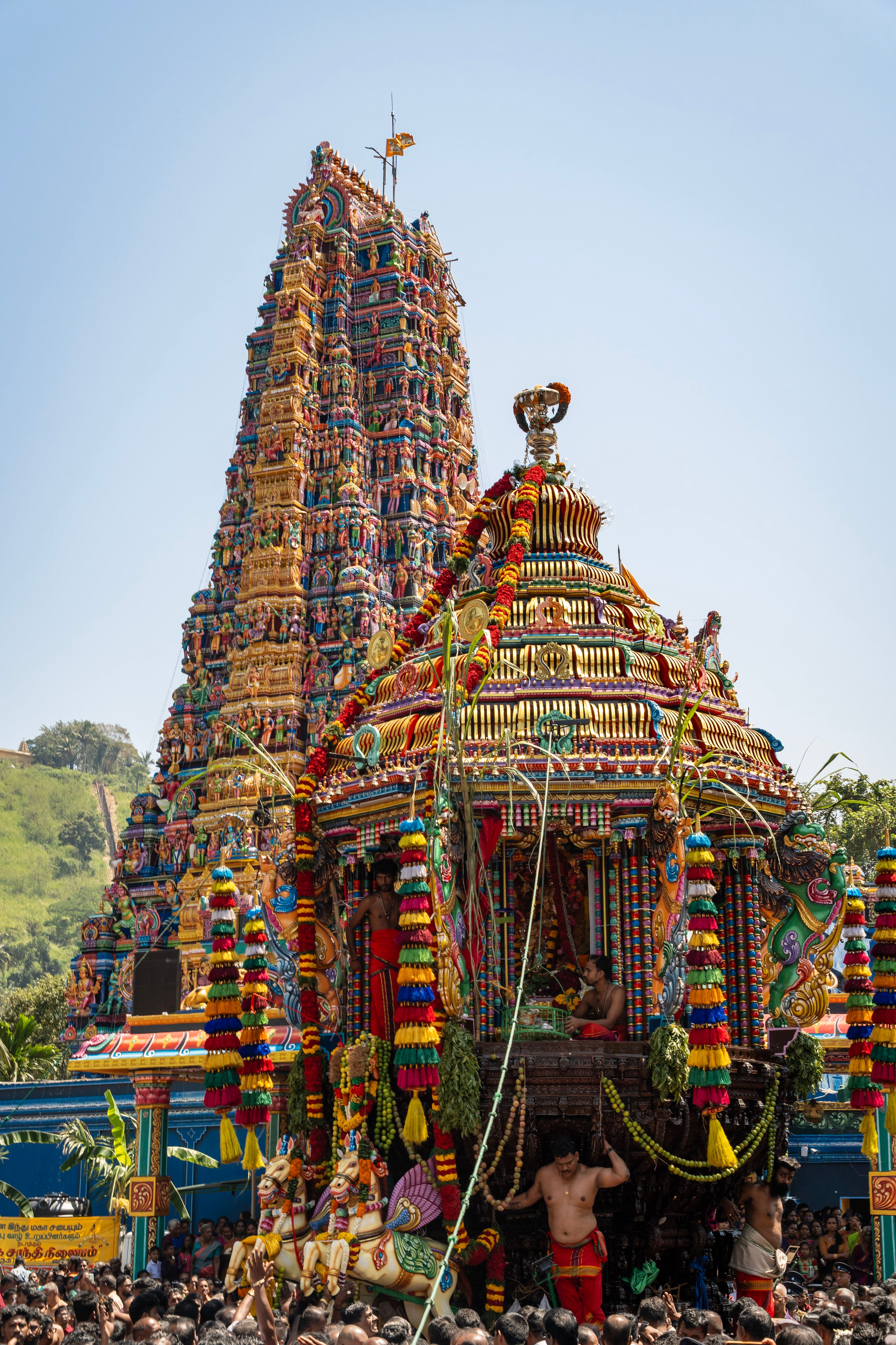 Colorful celebration of Theru Festival at a Hindu temple in Matale, Sri Lanka with large crowds and vibrant decorations.
