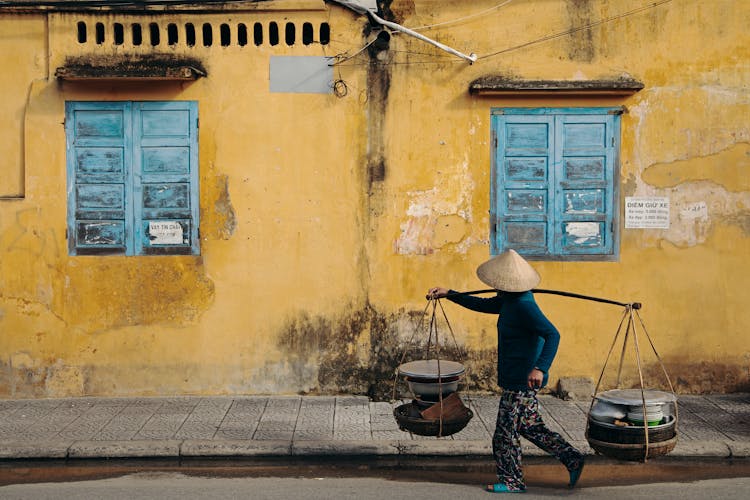 A Merchant Walking On The Street