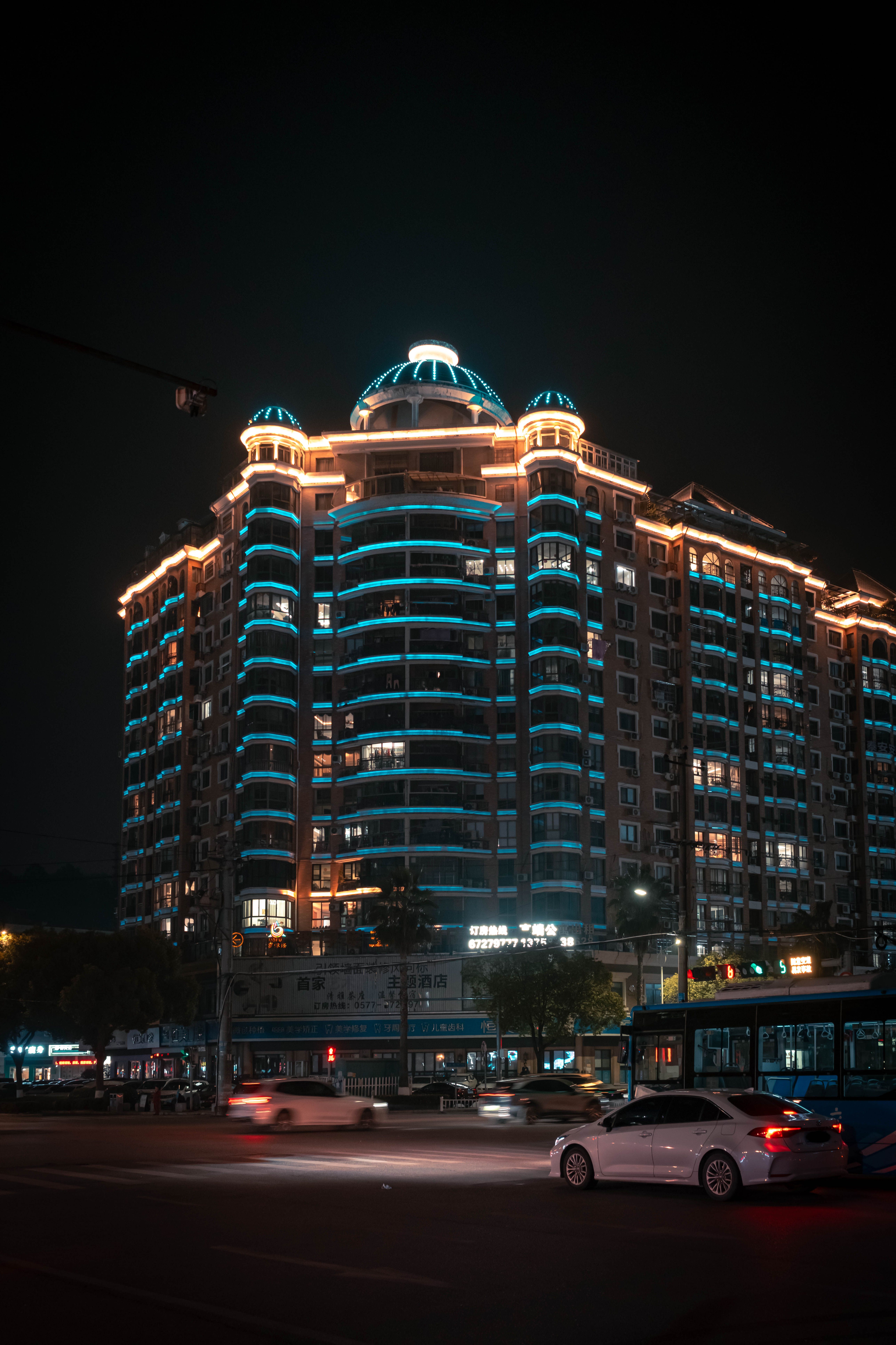 Illuminated High-Rise Building at Night · Free Stock Photo