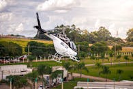 Helicopter Flying Over Scenic Countryside