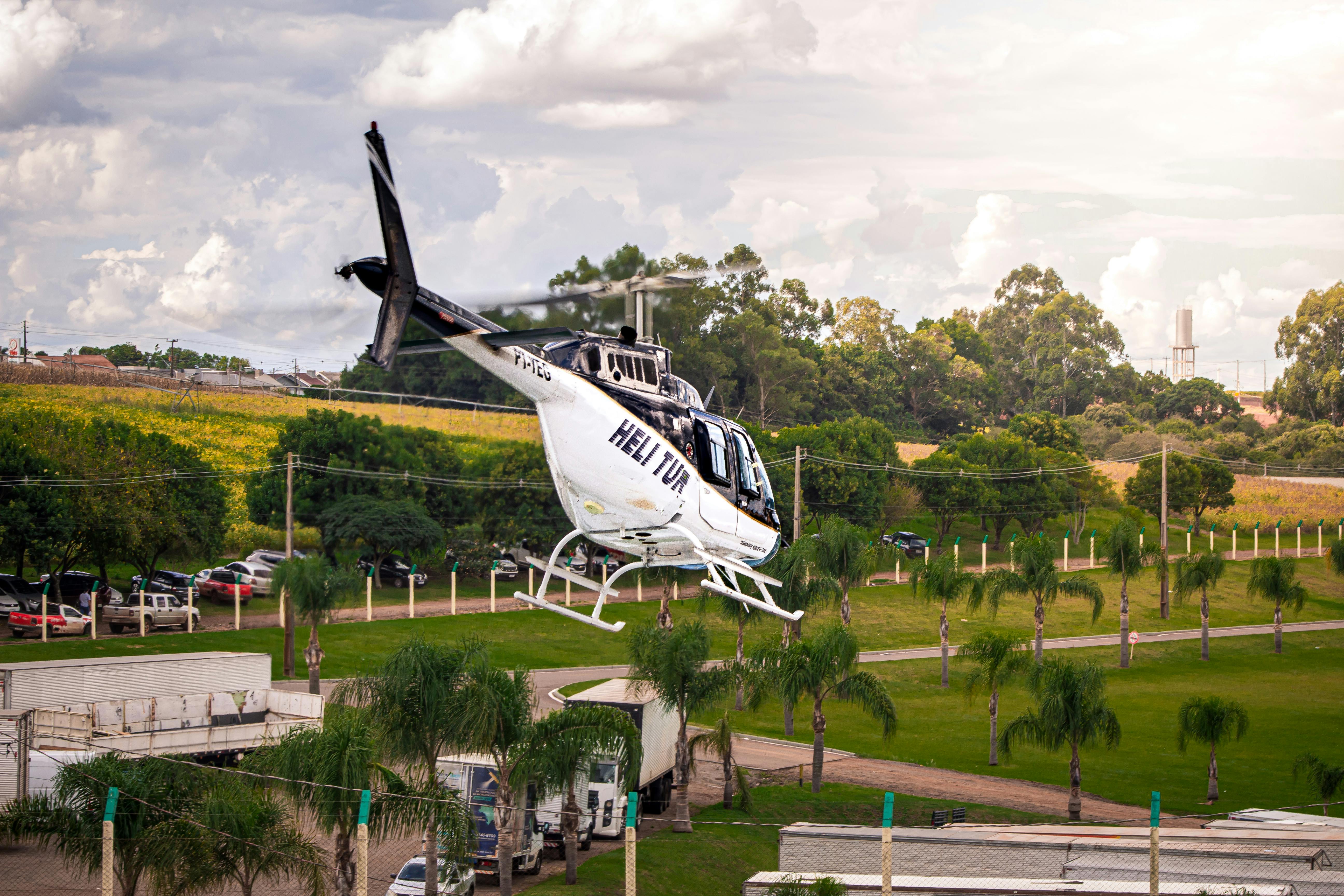 Helicopter Flying Over Scenic Countryside