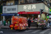 Street Vendor with Lanterns and Florist in Urban Setting
