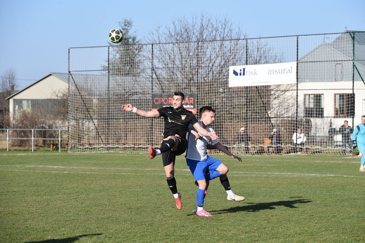 two players battle for the ball in an outdoor soccer match in v s rosn