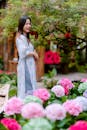 Young Woman in Traditional Attire Among Flowers