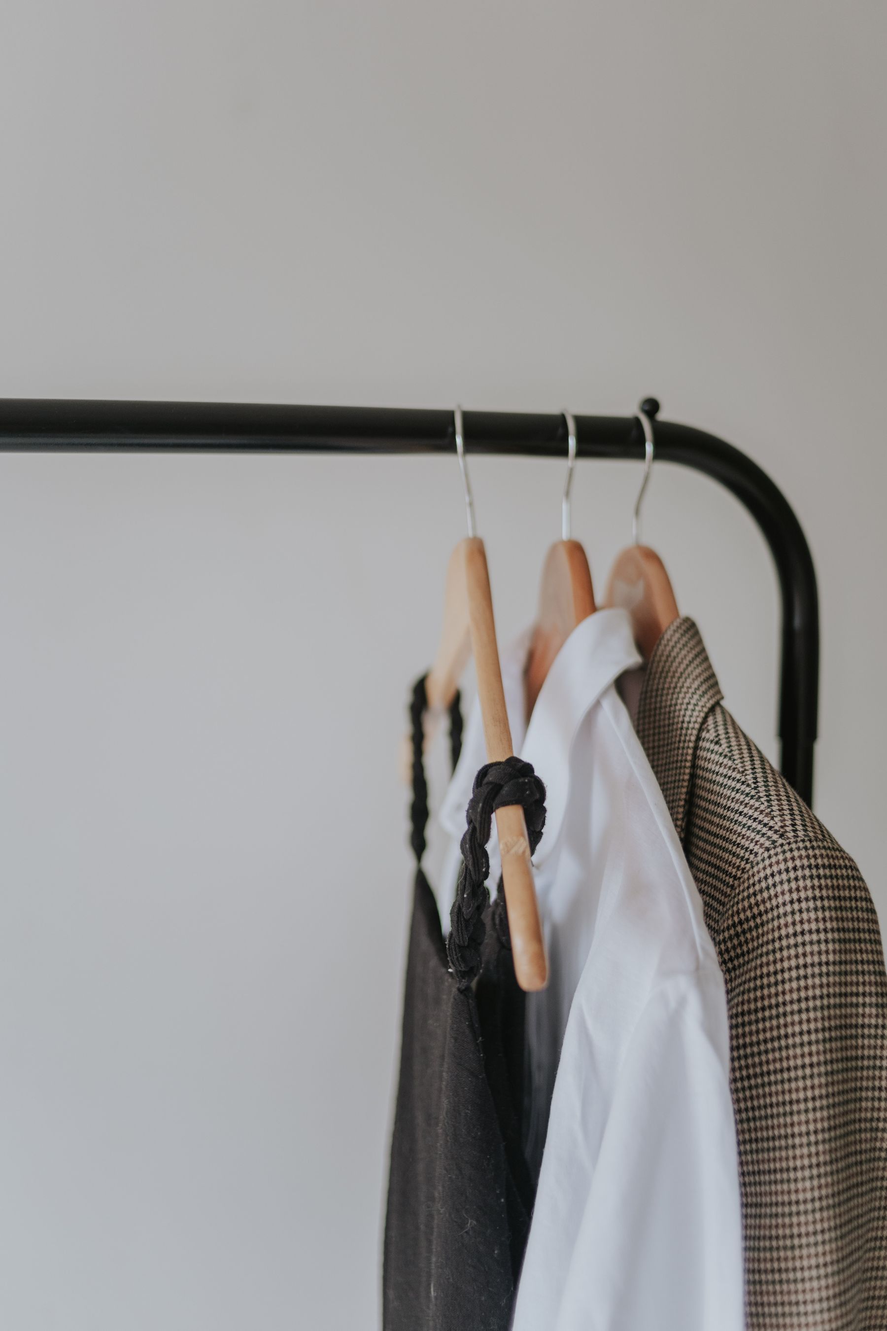 Neutral apparel collection on a clothing rack