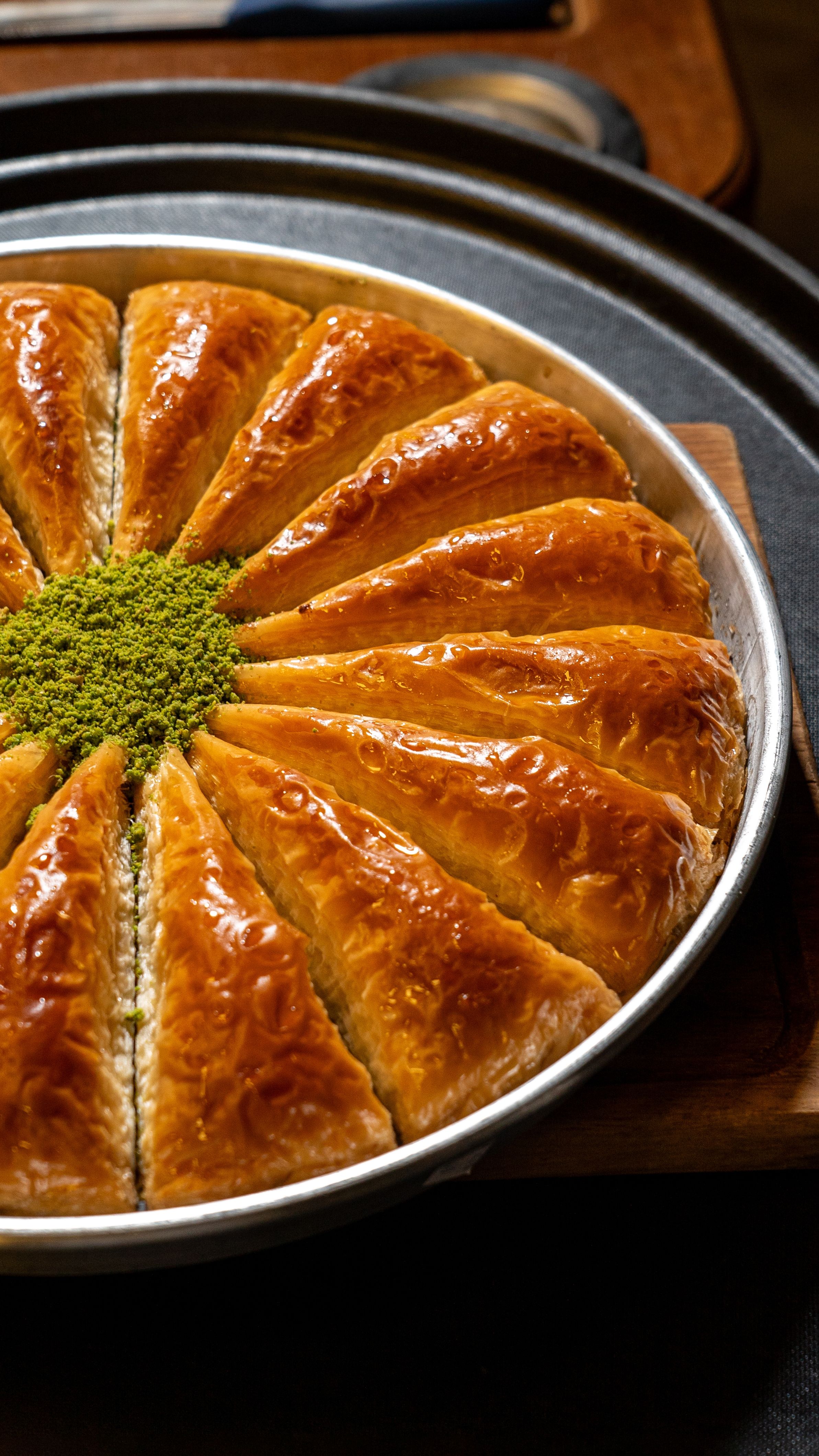 A close-up of baklava slices with pistachio topping, perfect for food lovers.