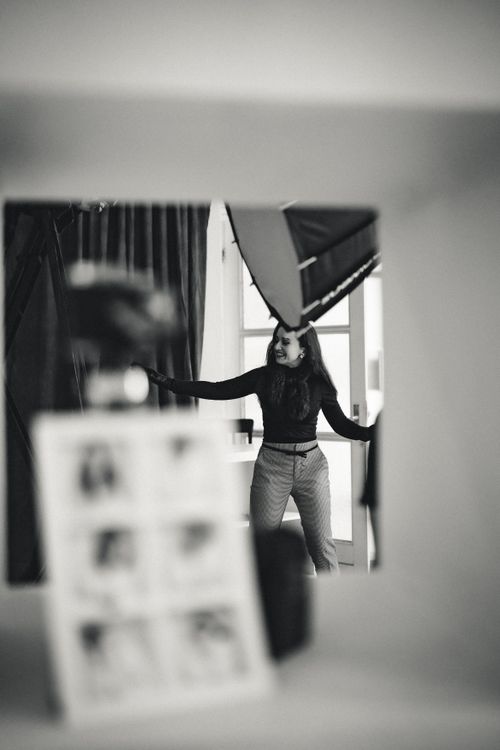 Free Elegant black and white photo of a woman posing in a photography studio setting. Stock Photo