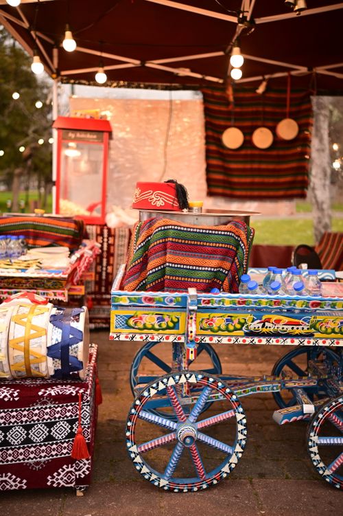Free Lively display of handcrafted items at a vibrant outdoor market at night. Stock Photo