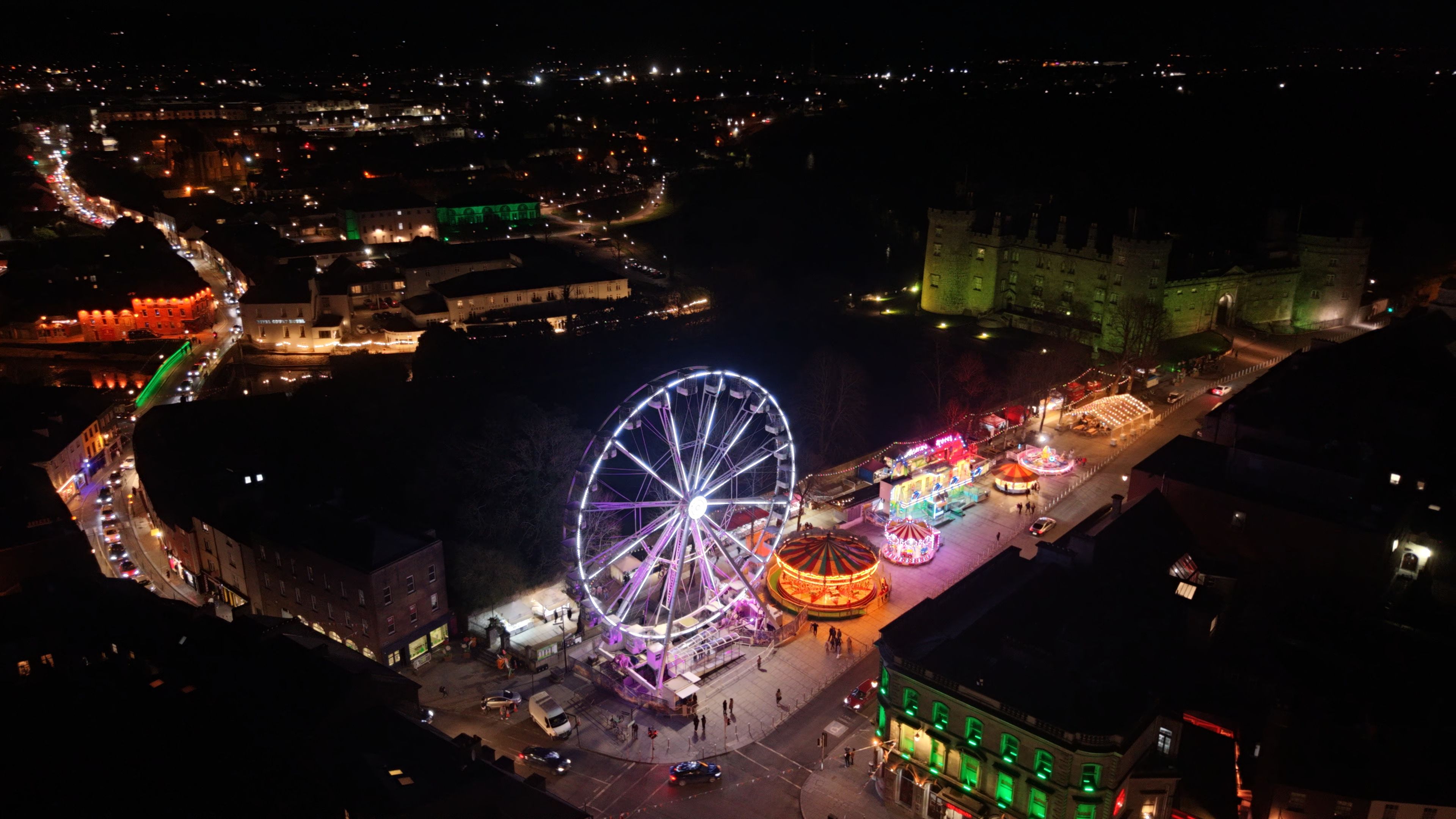 Aerial Night View of Festive Ferris Wheel · Free Stock Photo