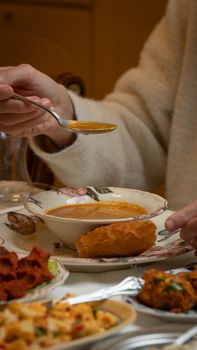 A cozy dining scene featuring traditional Gaziantep cuisine with soup and appetizers, ideal for food lovers.