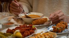 Traditional Turkish meal with soup, bread, and appetizers in Gaziantep.