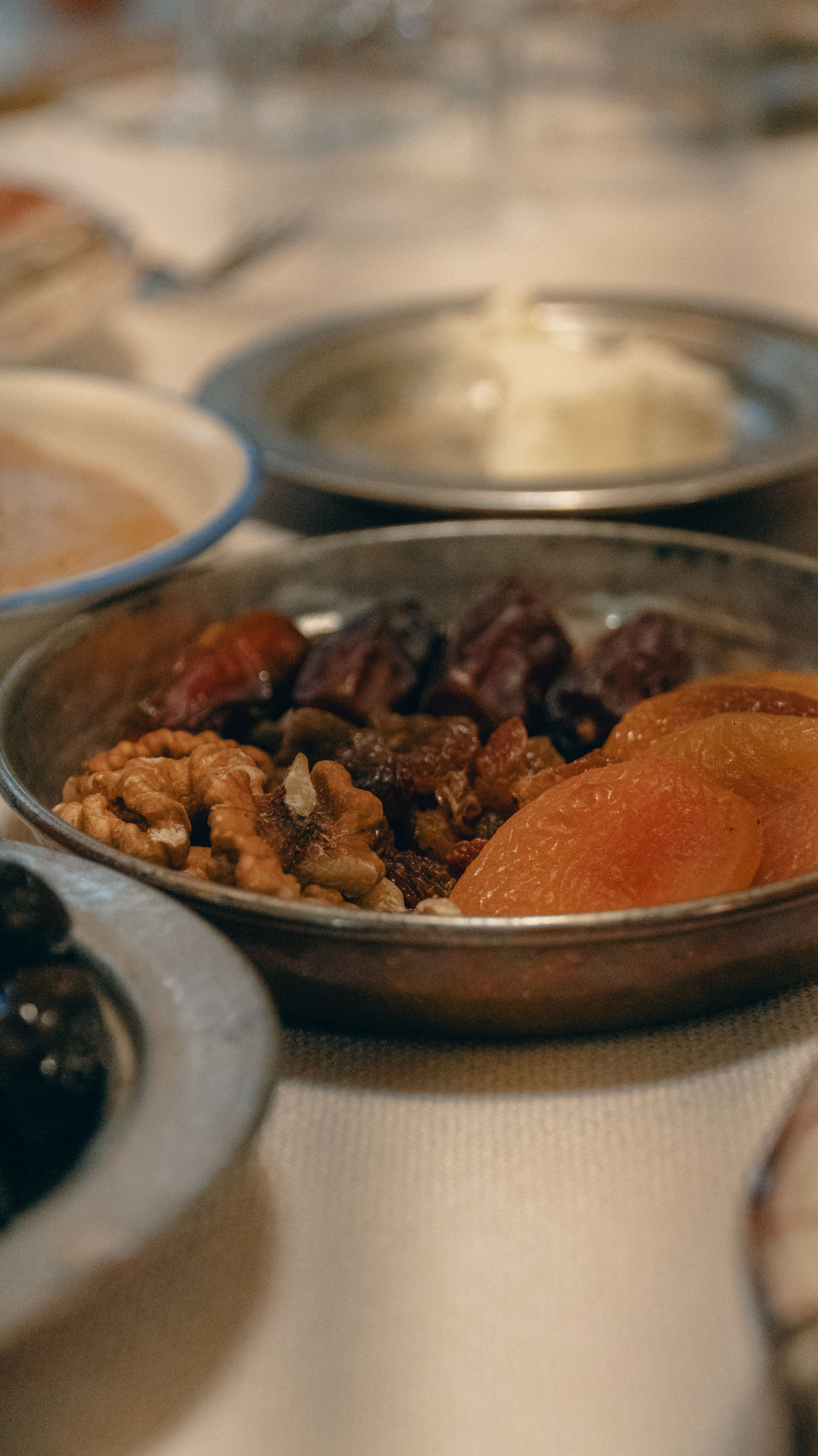 Close-up of a traditional Turkish dish with nuts and dried fruits, perfect for coffee tables.