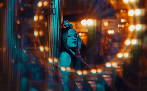 Free Artistic portrait of a woman at night with vibrant lights in Buenos Aires. Stock Photo